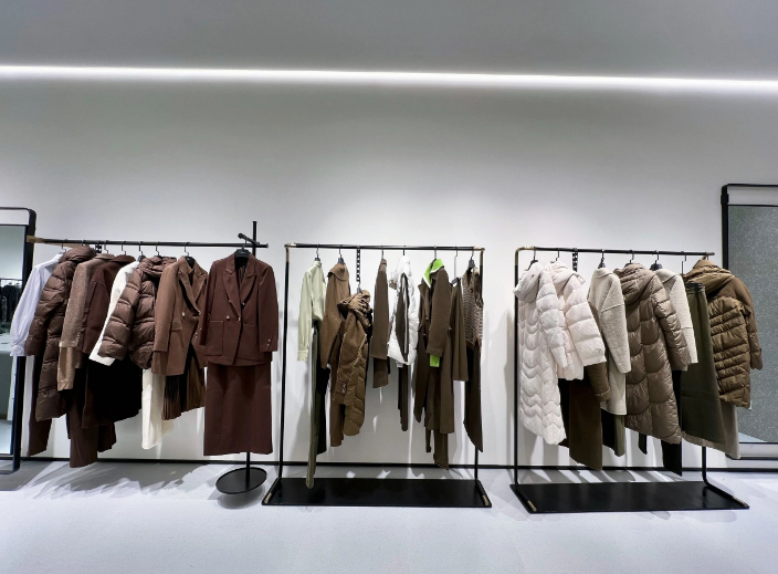 Fashion design studio with garments on racks