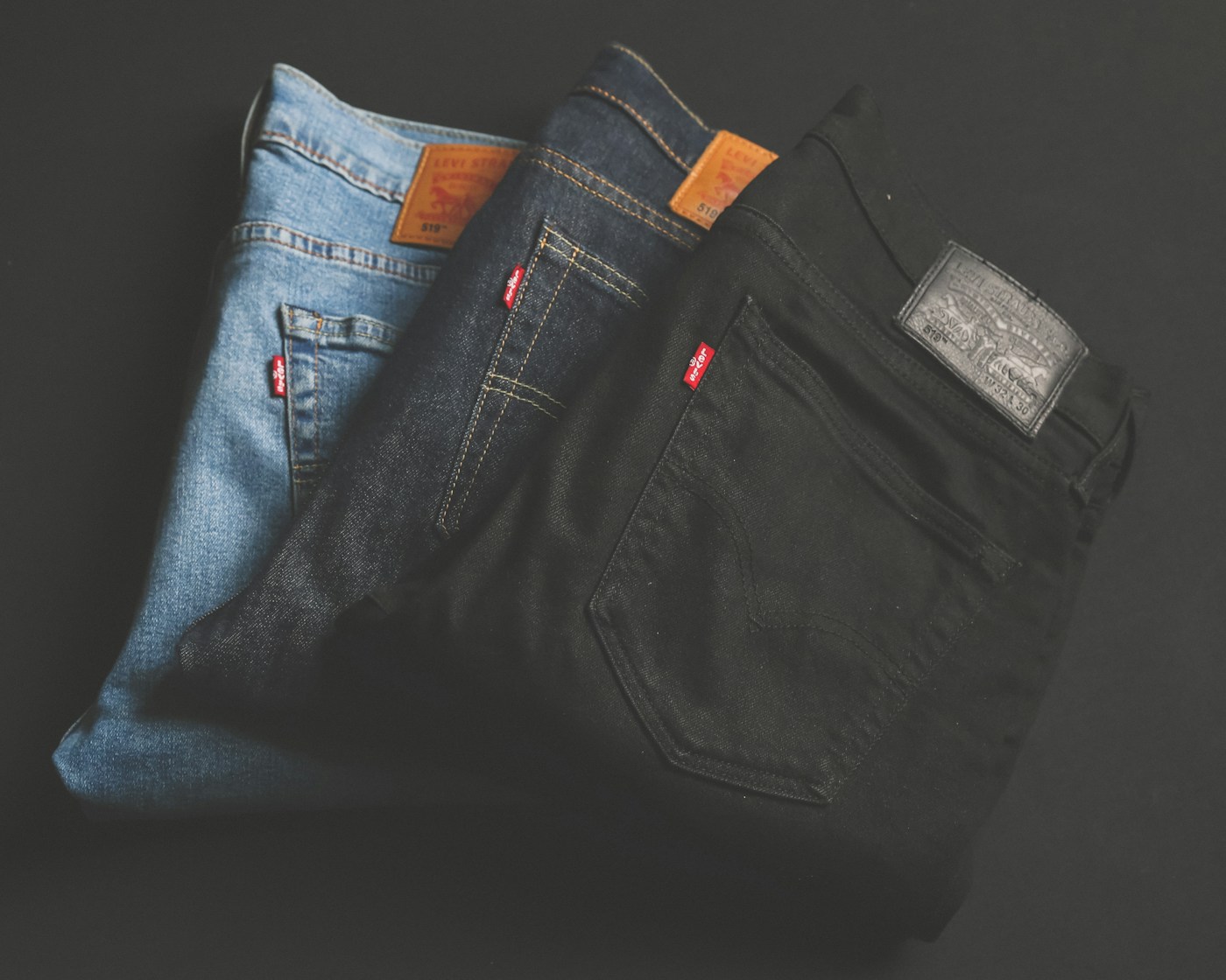Denim jeans folded on retail shelf